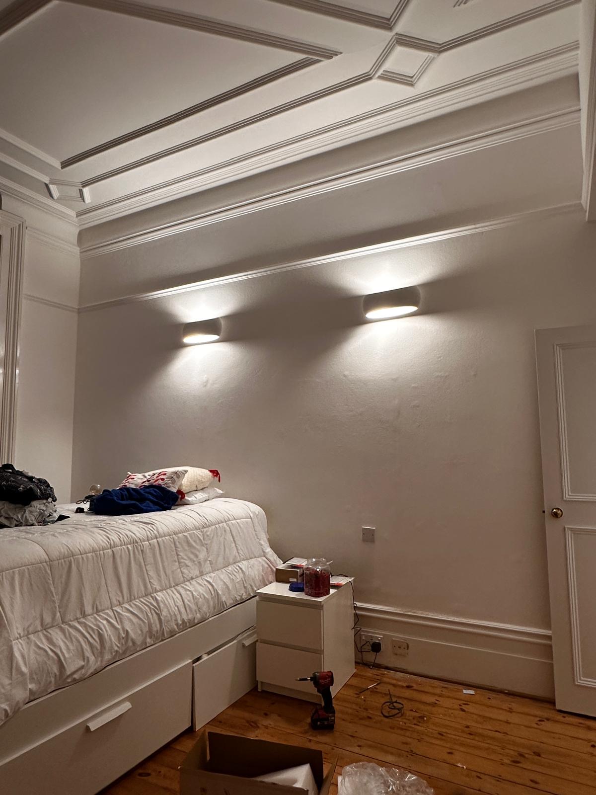 Bedroom after: wall lights installed